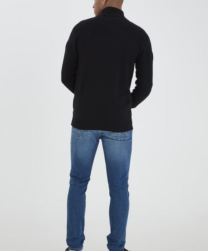Ryggen av svart cardigan i 100% bomull